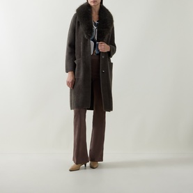 Model wearing Joseph Ribkoff Faux Fur Trim Knitted Cardigan in Avocado with faux fur shawl collar, styled with wide-leg trousers and heels.