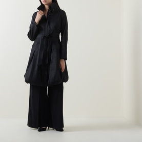 Model wearing Joseph Ribkoff black belted shirt-style coat with wide-leg trousers and black heels.