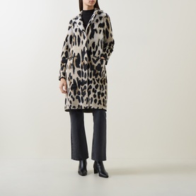 Model wearing Joseph Ribkoff Coat in camel/multi leopard print, styled with black wide-leg trousers and black ankle boots.