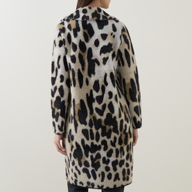 Model wearing Joseph Ribkoff Coat in camel and black leopard print, back view, longline silhouette with long sleeves.