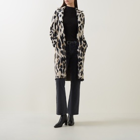 Model wearing Joseph Ribkoff Camel/Multi leopard print coat, styled with black roll-neck, dark jeans and black heeled ankle boots.