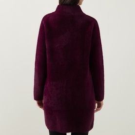 Model wearing Joseph Ribkoff Statement Button Knitted Coat in Elderberry, back view showing mock neck and textured straight-hem silhouette.