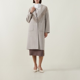 Model wearing Joseph Ribkoff Oatmeal coat with fringe collar detail, styled with white turtleneck and beige midi skirt