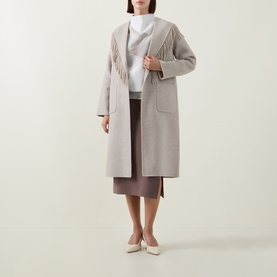 Model wearing Joseph Ribkoff oatmeal coat with fringe detail, styled with a brown midi skirt and cream heels.