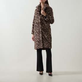 Model wearing Joseph Ribkoff Leopard Print Faux Fur Coat in beige/multi, longline with notch lapel, styled with black flared trousers and heels