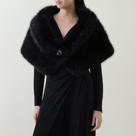 Model wearing Joseph Ribkoff Faux-Fur Collar Stole in black with rhinestone brooch closure, styled over a black dress