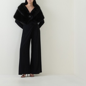 Model wearing Joseph Ribkoff Faux-Fur Collar Stole in black with rhinestone brooch clasp, styled with wide-leg black trousers