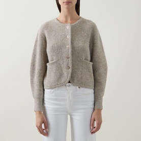 Model wearing Joseph Ribkoff Rib-Knit Cardigan in Oatmeal Melange, round neck, button front, patch pockets, styled with white jeans