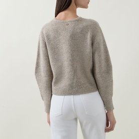 Model wearing Joseph Ribkoff Rib-Knit Cardigan in Oatmeal Melange, rear view showing dropped shoulders and rib-knit texture, styled with white jeans