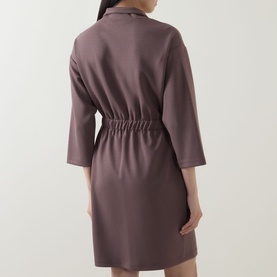 Model wearing a mauve short robe with three-quarter sleeves, collared neckline, and elasticated waist, seen from behind