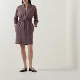 Model wearing a knee-length dusty mauve robe with drawstring waist and long sleeves, styled with black flat shoes.