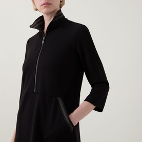 Model wearing Joseph Ribkoff Dress in Black/Avocado, cropped view showing zip-front funnel neck and three-quarter sleeves with contrast trim detail.