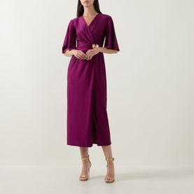 Model wearing Joseph Ribkoff Gathered Hardware-Detail Wrap Dress in Berry Burst, midi length with flutter sleeves and gold hardware waist detail,