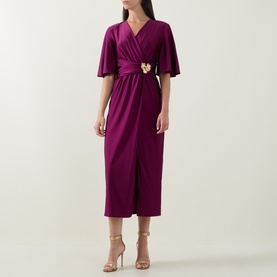 Model wearing Joseph Ribkoff Gathered Hardware-Detail Wrap Dress in Berry Burst, flutter sleeves, gold hardware waist detail, midi length, styled