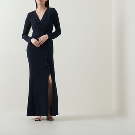 Model wearing Joseph Ribkoff Metallic Wrap Gown Dress in navy, maxi length with long sleeves, V-neck, wrap front and slit hem