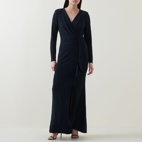 Model wearing Joseph Ribkoff Metallic Wrap Gown Dress in navy, maxi length with V-neck, long sleeves, shimmer fabric and slit hem