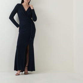 Model wearing Joseph Ribkoff Metallic Wrap Gown Dress in navy, maxi length with long sleeves, V-neck, wrap front, and slit hem