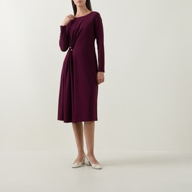 Model wearing Joseph Ribkoff Gathered Hardware-Detail Dress in Elderberry, midi length, long sleeves, side-gathered detail with hardware, styled with