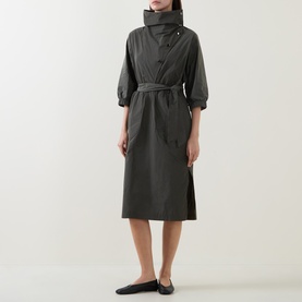 Model wearing Joseph Ribkoff Dress in Avocado, belted midi length with high collar and short sleeves, styled with black flat shoes
