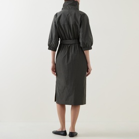 Model wearing Joseph Ribkoff Dress in Avocado, back view, high neck, puff sleeves, belted waist, midi length, with black flat shoes.