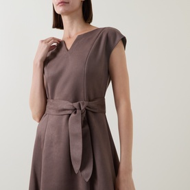 Model wearing Joseph Ribkoff Dress in Mink, featuring V-neckline, cap sleeves, and self-tie waist belt, A-line silhouette