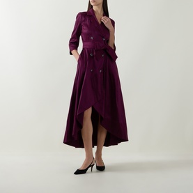 Model wearing Joseph Ribkoff Double-Breasted Blazer Dress in Berry Burst, flared high-low hem, self-tie belt, styled with black heels.