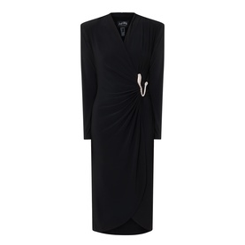 Joseph Ribkoff black long-sleeve midi dress with V-neckline, ruched wrap skirt, and silver safety pin brooch detail.