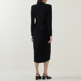 Model wearing Joseph Ribkoff black long-sleeve midi dress with structured shoulders, styled with black heeled mules.