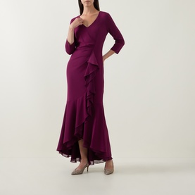 Model wearing Joseph Ribkoff Berry Burst maxi dress with V-neckline, three-quarter sleeves, and cascading ruffle skirt, styled with nude heels.