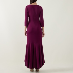 Model wearing Joseph Ribkoff Berry Burst maxi dress, back view, 3/4 sleeves, fitted bodice with flared hem skirt.