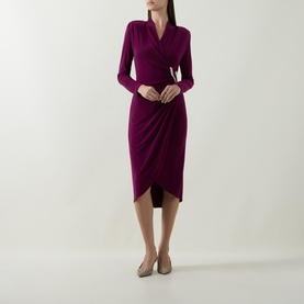 Model wearing Joseph Ribkoff Berry Burst wrap dress with long sleeves and draped tulip hem, styled with nude heels