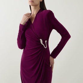 Model wearing Joseph Ribkoff Berry Burst wrap dress with ruched waist, crystal brooch detail, and long sleeves in stretch jersey fabric.