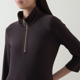 Model wearing Joseph Ribkoff Dress in Mocha, featuring a quarter-zip funnel neck and three-quarter sleeves in stretch fabric.