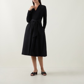 Model wearing Joseph Ribkoff Contrast Self-Tie Flared Dress in black, V-neck, long sleeves, self-tie belt, midi length, styled with black slider