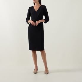 Model wearing Joseph Ribkoff Gathered Bow Pencil Dress in black, V-neckline, three-quarter sleeves, midi length, styled with nude heels