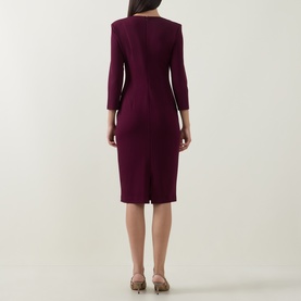 Model wearing Joseph Ribkoff Gathered Bow Pencil Dress in Elderberry, showing rear view with three-quarter sleeves, rear vent and zip, midi length.