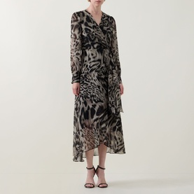 Model wearing Joseph Ribkoff grey multi animal print midi dress with long sleeves and wrap style, styled with black heeled sandals.