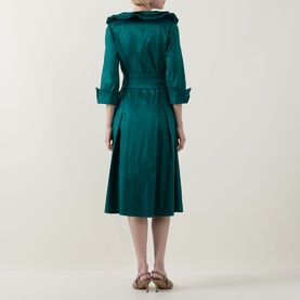 Model wearing Joseph Ribkoff Dress in Opulent Green, shown from behind, featuring wide collar, 3/4 sleeves, belted waist and midi-length flared skirt.