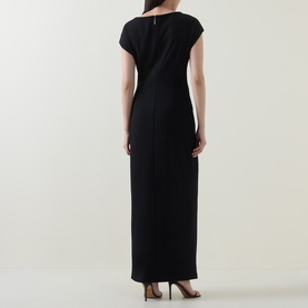 Model wearing Joseph Ribkoff Rhinestone Side-Slit Gown Dress in black, maxi length with cap sleeves, shown from the back, styled with heeled sandals.