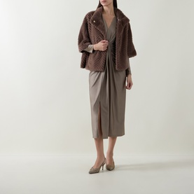 Model wearing Joseph Ribkoff Chevron Quilted Faux Fur Jacket in Mink, styled with a grey wrap midi dress and taupe heels.