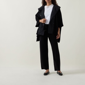 Model wearing Joseph Ribkoff black oversized jacket with wide-leg trousers, white tee and black loafers.