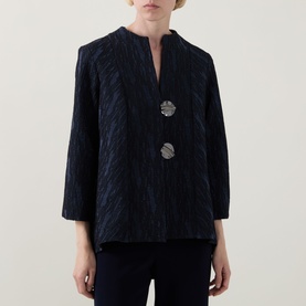 Model wearing Joseph Ribkoff navy textured jacket with V-neckline, three-quarter sleeves, and two decorative silver buttons.
