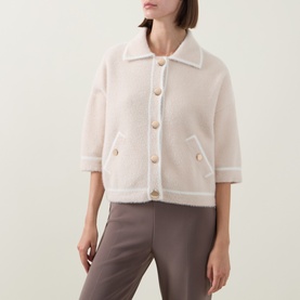 Model wearing Joseph Ribkoff Oatmeal/Winter White textured jacket with collar, gold buttons, and front pockets, styled with taupe trousers.