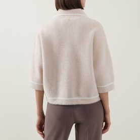 Model wearing Joseph Ribkoff Jacket in Oatmeal/Winter White, back view, boxy fit with elbow-length sleeves, styled with taupe trousers.