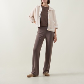 Model wearing Joseph Ribkoff Oatmeal/Winter White nylon jacket with brown wide-leg trousers and tan flats.