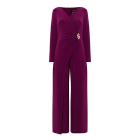 Joseph Ribkoff Berry Burst jumpsuit in deep magenta, wrap-style bodice with ruched waist, gold brooch detail, wide-leg trousers, long sleeves
