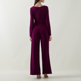 Model wearing Joseph Ribkoff Jumpsuit in Berry Burst, back view, long sleeves, wide-leg silhouette, fitted waist.