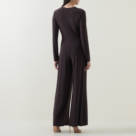 Model wearing Joseph Ribkoff Jumpsuit in Mocha, back view, long sleeves, wide-leg silhouette in stretch jersey fabric.