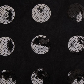 Joseph Ribkoff Pom Pom Embellished Knitted Scarf in black, close-up showing silver sequin circular appliqu&eacute; embellishments on knit fabric