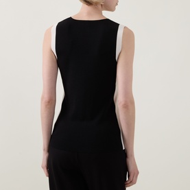 Model wearing Joseph Ribkoff Top in Black/Birch, sleeveless with contrast side panels, fitted silhouette, back view, styled with black trousers